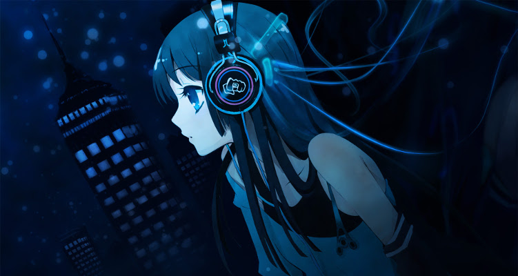 A girl listening to music while looking at the city